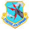 Strategic Air Command shield patch with a gray armored fist gripping three red lightning bolts and an olive branch on a sky blue field, over a white STRATEGIC AIR COMMAND scroll.