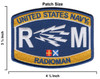 Size Embroidered United States Navy Radioman RM rating patch with gold and navy blue field, white lightning bolt cluster, large R and M letters, naval signal flags, and merrowed border. Measures 4.5 by 3.25 inches.