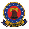 Round USS Independence patch with a brown Liberty Bell on a red field, thirteen white stars on a blue ring, a gold rope border and a gold USS INDEPENDENCE scroll.