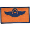 Wings patch with wreath and star insignia in gold and blue representing senior command pilot qualification.