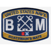 Keystone shaped embroidered Boatswain's Mate rating patch with gold bands reading United States Navy and Boatswain's Mate, white crossed anchors between large white B and M letters, and Bravo and Mike signal flags on a navy blue field.
