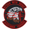 Rectangular patch with bold military imagery and text reading SERE training designation, featuring standard Air Force color scheme of blues and silvers with embroidered borders.