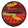 Round patch with a black submarine silhouette crossing a gold grid under a red sky and gold clouds, PRIDE RUNS DEEP in black letters along the bottom.