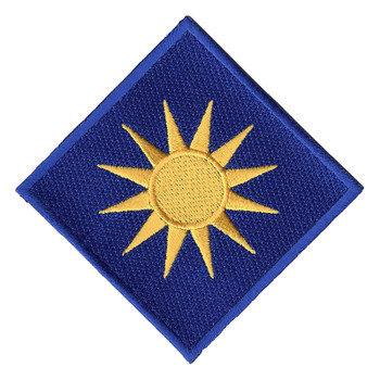 Diamond-shaped 40th Infantry Division patch worn on point, with a royal blue border around a navy blue field and a golden-yellow sun with twelve pointed rays in the center, the Sunburst Division emblem.