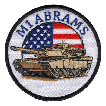 Round M1 Abrams tank patch with a desert tan tank in front of a half-round American flag and M1 ABRAMS in navy blue on white.