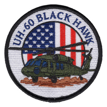 Round UH-60 Black Hawk patch with a green Army helicopter on tan dust in front of an American flag circle, lettered UH-60 BLACK HAWK in blue on white with a black edge.