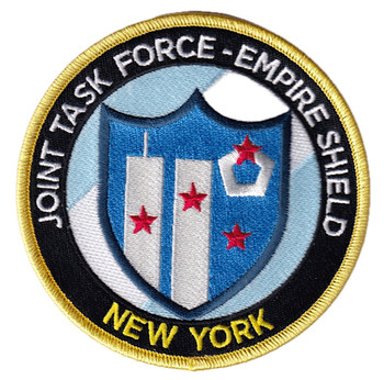 Joint Task Force Empire Shield New York circular patch with center shield showing Twin Towers Pentagon and red stars on black gold field