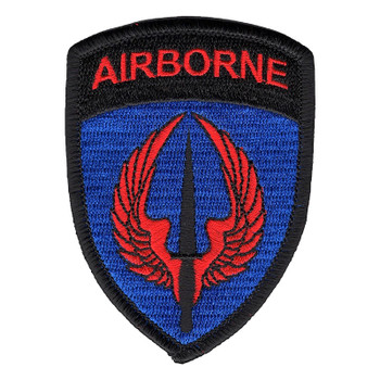 Shield-shaped USASOAC patch with red upswept wings around a black Fairbairn-Sykes knife on a royal blue field, under a black AIRBORNE tab in red letters.