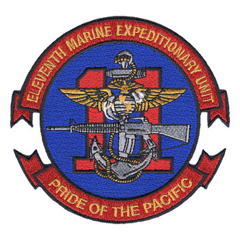 11th Marine Expeditionary Unit patch with a red 11 behind a fouled anchor, gold wings and a rifle on a blue circle, with red scrolls lettered in gold, PRIDE OF THE PACIFIC below.