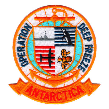 Round Operation Deep Freeze Antarctica patch with an orange anchor behind a quartered shield showing a ship, penguin, aircraft and Seabee bee, over an orange ANTARCTICA banner.