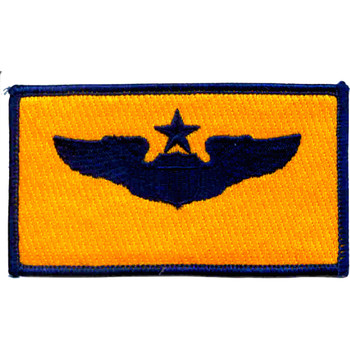 Senior pilot wings patch in gold and blue colors representing highest aviator rank and command-level flying achievement.