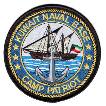 Round embroidered patch with black merrowed border and rope-twist ring, depicting a Kuwaiti dhow under sail flying the Kuwaiti flag over blue Gulf waters with a gray naval anchor in the foreground, gold text reading Kuwait Naval Base and Camp Patriot, surrounded by gold stars on a blue border.
