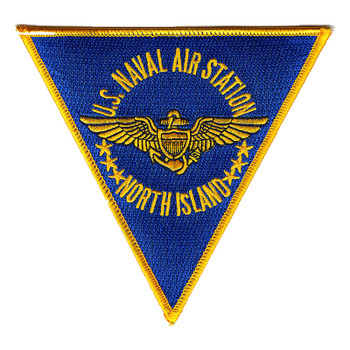 Inverted triangle NAS North Island patch with a gold merrowed edge, gold U.S. NAVAL AIR STATION and NORTH ISLAND lettering on royal blue, and gold aviator wings flanked by three stars on each side.