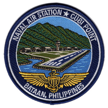 Round navy patch showing the Cubi Point runway running out into Subic Bay below a green mountain ridge, with the control tower and hangars at the tree line. Gold Naval Aviator wings cross the bottom, lettered NAVAL AIR STATION CUBI POINT and BATAAN, PHILIPPINES.