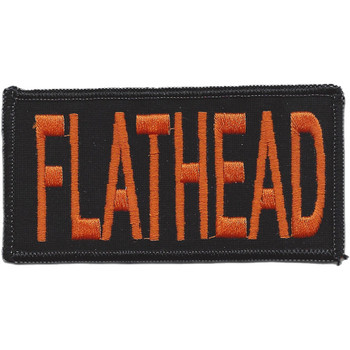 Rectangular embroidered patch with bold orange block lettering spelling FLATHEAD on a solid black field, finished with a merrowed overlock border. Measures 4 inches wide by 2 inches tall.