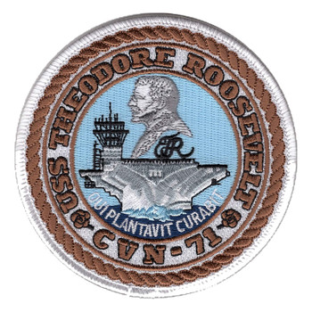 Round USS Theodore Roosevelt CVN-71 patch with a white merrowed edge, brown rope ring, Roosevelt's profile over a carrier, two roses and the motto QUI PLANTAVIT CURABIT.