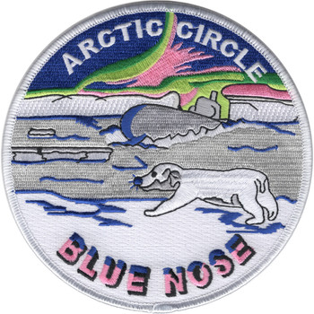 Round embroidered Arctic Circle Blue Nose patch showing a submarine surfacing through ice, a polar bear crossing the floe, and green and pink aurora over a dark sky, with Blue Nose in pink block letters below.