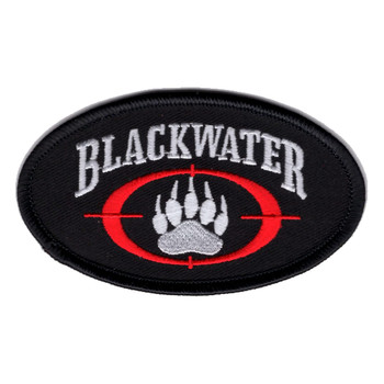 Oval black patch with BLACKWATER in white letters above a white bear paw inside a red crosshair reticle.