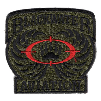 Olive drab Blackwater Aviation patch with black lettering, swept black wings, and a black bear paw inside red crosshairs.