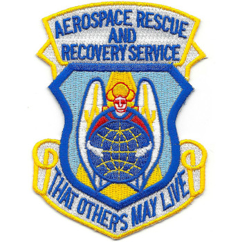 Shield-shaped embroidered patch with light blue field, gold border, "Aerospace Rescue and Recovery Service" arcing across top, nested inner shield with angel in red over globe flanked by white wings, and "That Others May Live" scroll at bottom.