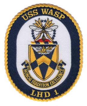 Oval embroidered patch for USS Wasp LHD-1 showing the official ship crest with a wasp insect above crossed gold tridents and a blue-and-gold heraldic shield, with 'Honor Tradition Excellence' scroll and gold merrowed border. Text reads USS Wasp at top and LHD 1 at bottom.