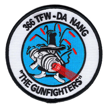 Round 366 TFW Da Nang The Gunfighters patch showing the cartoon Spook in a black fedora firing a striped gun pod with a red blast on a light blue center.