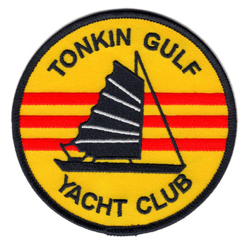 Round Tonkin Gulf Yacht Club patch with a black junk sailing over a yellow field with three red stripes, navy blue merrowed border.