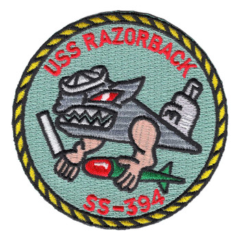 Round embroidered USS Razorback SS-394 patch with a gray hog in a white sailor's Dixie cup hauling a torpedo, red lettering on pale green inside a yellow and black rope border.