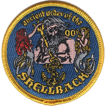 Round Ancient Order of the Shellback patch with bearded King Neptune holding a gold trident between two mermaids, a fouled anchor below and a gold merrowed edge.