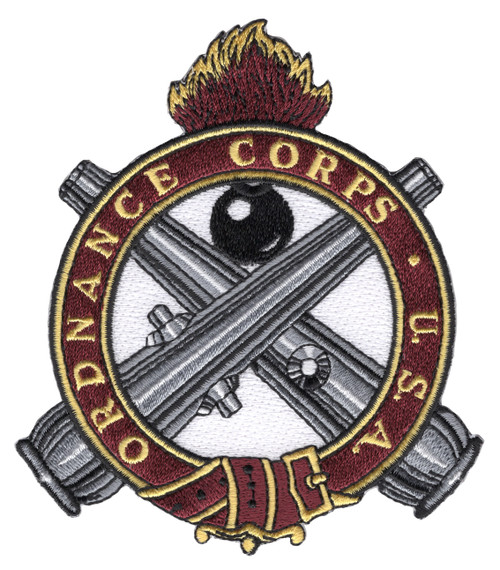 Army Ordnance Corps patch with a crimson and gold flame over a black bomb and crossed gray cannons, ringed by a crimson belt lettered ORDNANCE CORPS U.S.A.
