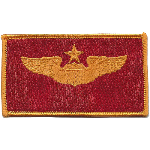 Senior pilot wings patch in red and gold colors representing highest aviator qualification and command authority in the cockpit.
