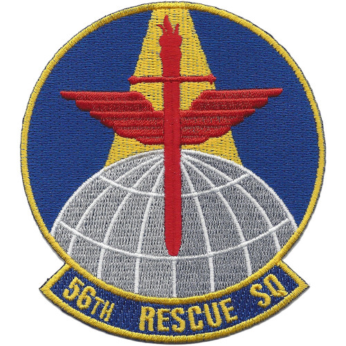 Circular embroidered patch with royal blue field, gold border, red Lorraine cross with red angled wings and gold torch at top, white gridded globe at base, and "56TH RESCUE SQ" gold scroll.