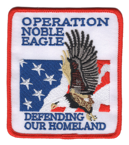 Patriotic patch with Operation Noble Eagle title, 2001 date, defense imagery in red white and blue.