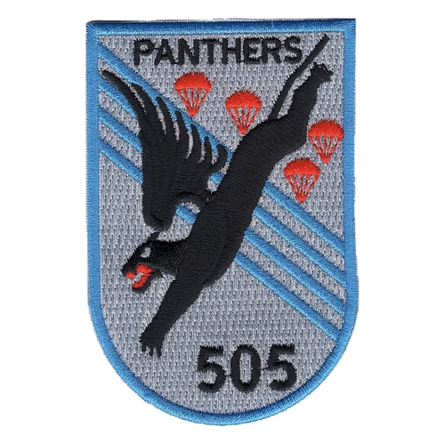 505th Panthers patch with a winged black panther diving head first past four red parachutes over light blue stripes on gray, PANTHERS at the top and 505 at the base.