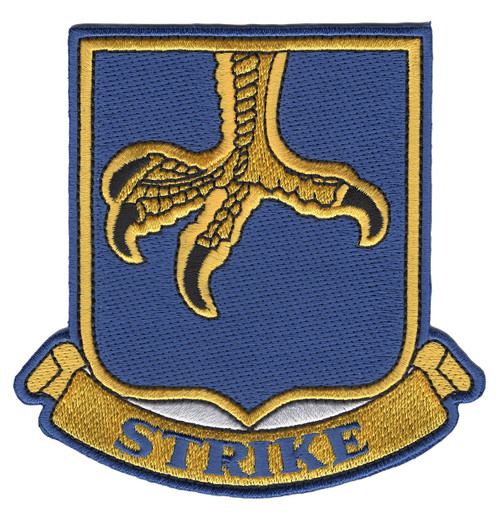 Embroidered heraldic shield patch in blue and gold showing a scaled eagle talon descending against a blue field with a gold banner reading STRIKE below, blue merrowed border, 3.5 inches square.