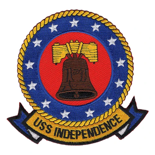 Round USS Independence patch with a brown Liberty Bell on a red field, thirteen white stars on a blue ring, a gold rope border and a gold USS INDEPENDENCE scroll.