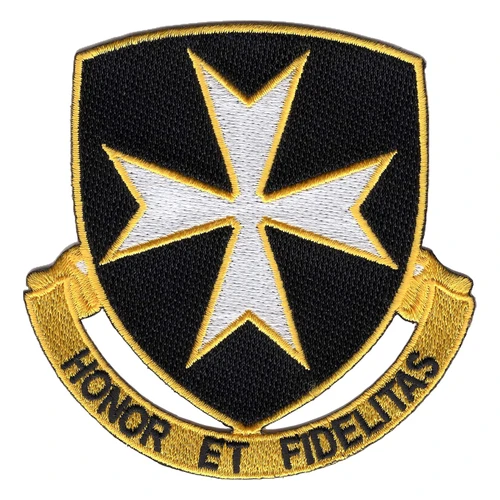 Black shield patch with a white eight-pointed cross outlined in gold, over a gold scroll reading Honor et Fidelitas, cut to the shield's outline.