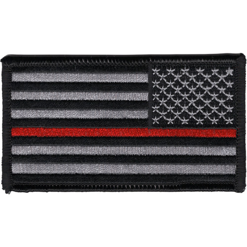 Rectangular embroidered American flag patch in subdued gray and black with a single thin red stripe through the stripes field, reversed orientation for right-shoulder wear, black merrow border.