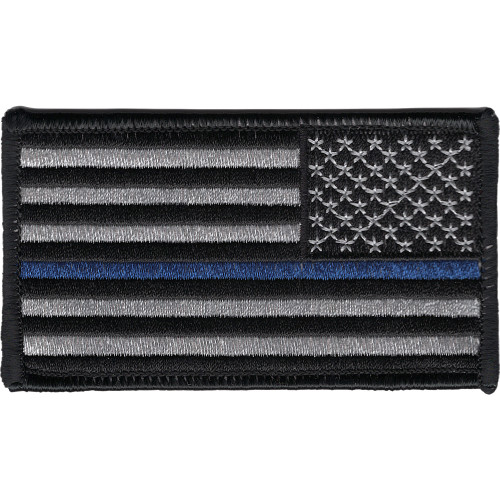 Rectangular embroidered American flag patch in subdued gray and black with a single thin blue stripe through the stripes field, reversed orientation for right-shoulder wear, black merrow border.