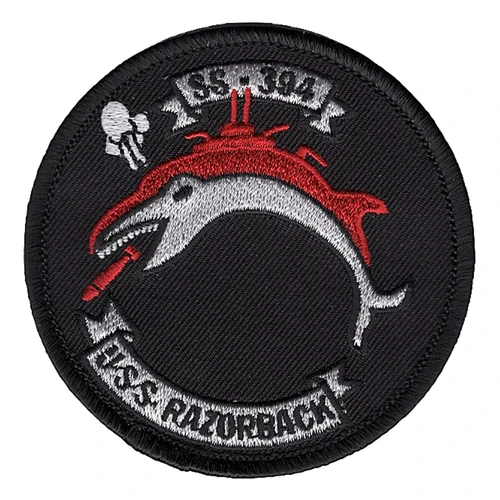 Round black USS Razorback SS-394 patch with a gray whale carrying a red submarine sail and a red torpedo at its jaw