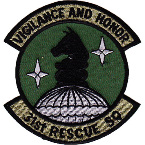 Circular subdued olive drab embroidered patch with tan scrolls reading "Vigilance and Honor" at top and "31st Rescue SQ" at bottom, black chess knight piece on white parachute dome at center, flanked by white four-pointed stars.