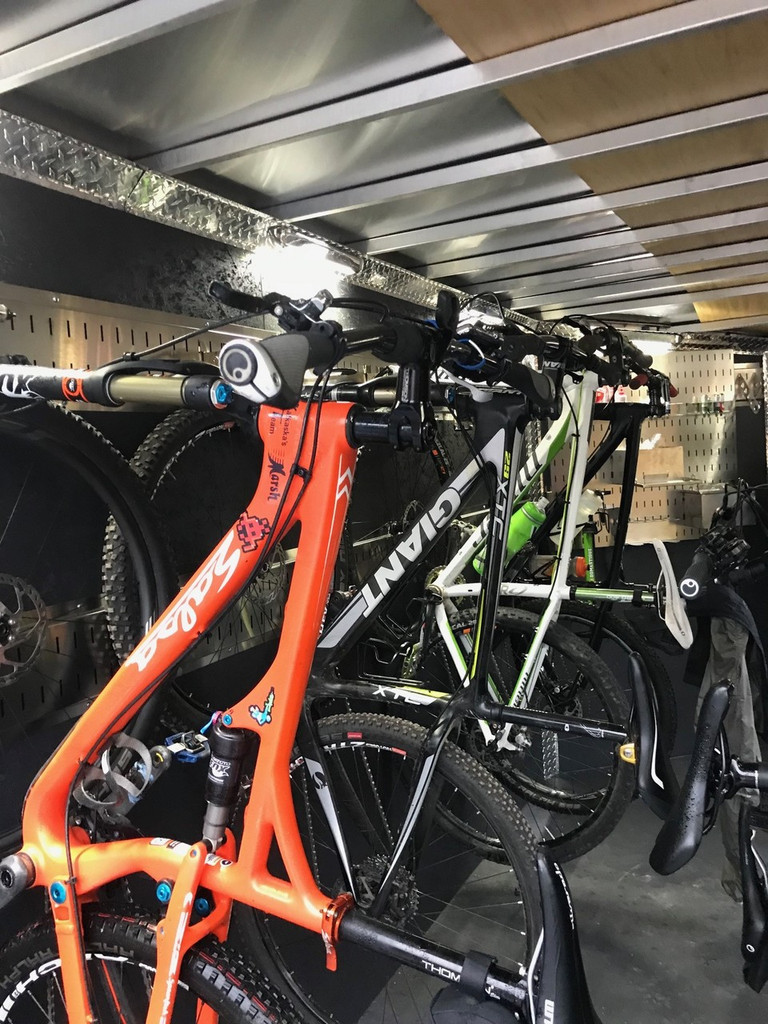 Both wheel-off and wheel-on mounts available.  The wheel-on mounts we're especially fond of for extremely convenient use.   Excellent mobile cycling gear storage in an enclosed trailer for hauling bicycles.