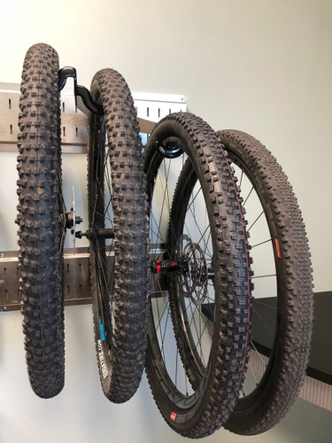 Valuable wheelsets off the ground.  Coated hooks protect your rims, and you're organized and damage free with your extra wheelsets.  Fit 2 wheelsets per hanger.