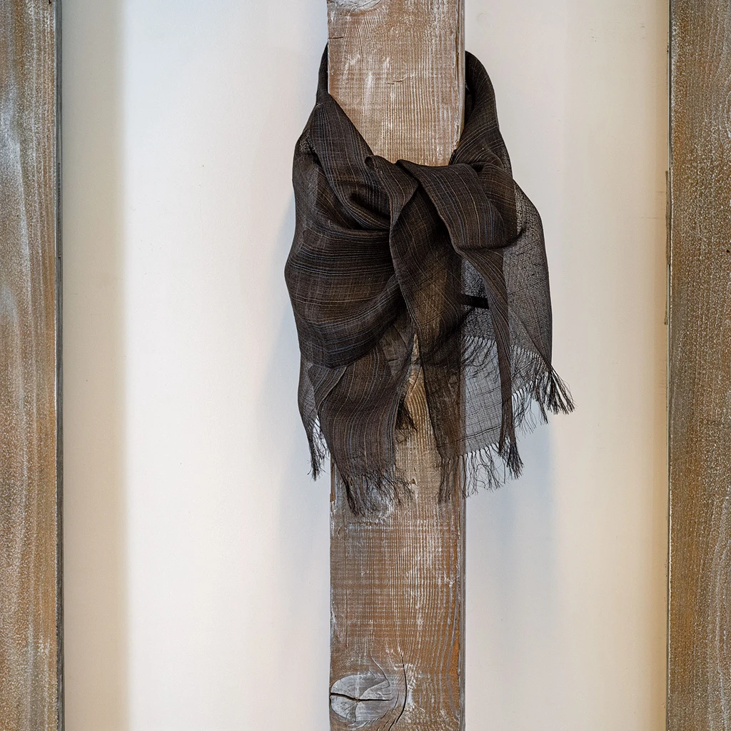 This gossamer silk shawls were designed by Kaori Maki of Japan and handwoven in India. Malda and Tassar Silk, dyes/harad, Indigo, 86" x 25"