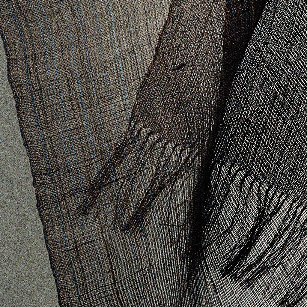 This gossamer silk shawls were designed by Kaori Maki of Japan and handwoven in India. Malda and Tassar Silk, dyes/harad, Indigo, 86" x 25"