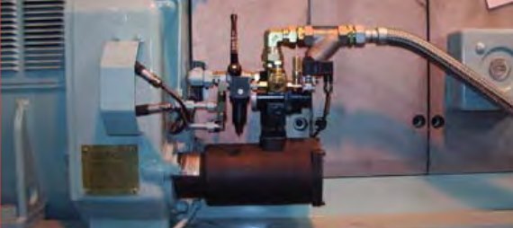Ingersoll Rand ST400 series turbine air starter installed on a generator set engine with strainer, relay valve and solenoid