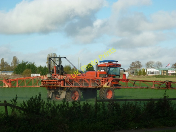Photo 6"x4" Busy spraying the field next to the A164 Hutton Cranswick c2010