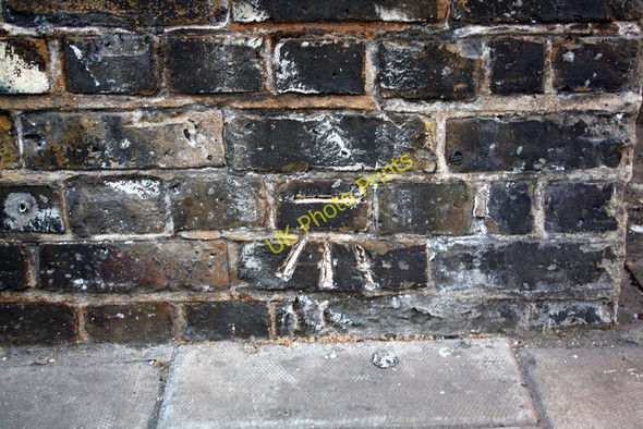 Photo 6"x4" Benchmark on railway viaduct at #22 Druid Street London c2011