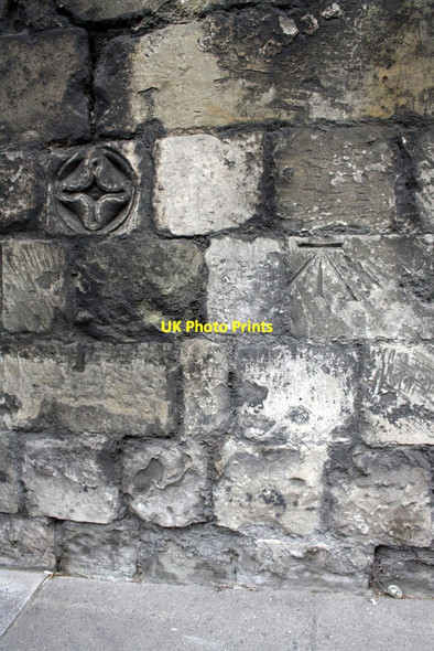 Photo 6"x4" Benchmark and decorative stone on Exeter Street wall Salisbury c2012