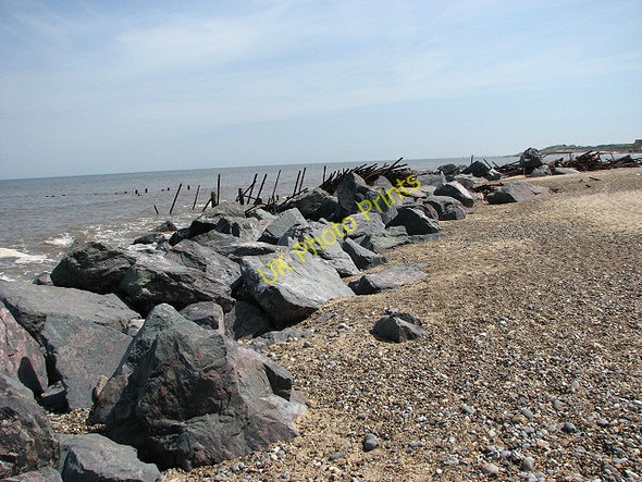 Photo 6"x4" Norwegian rocks and rusty steel pipes Happisburgh c2008